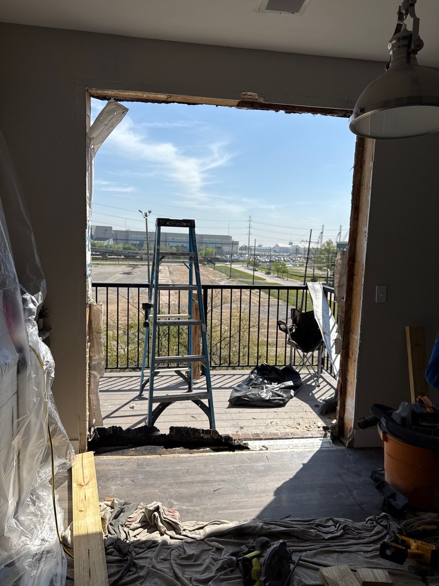 Door assembly removed, exposing full balcony opening