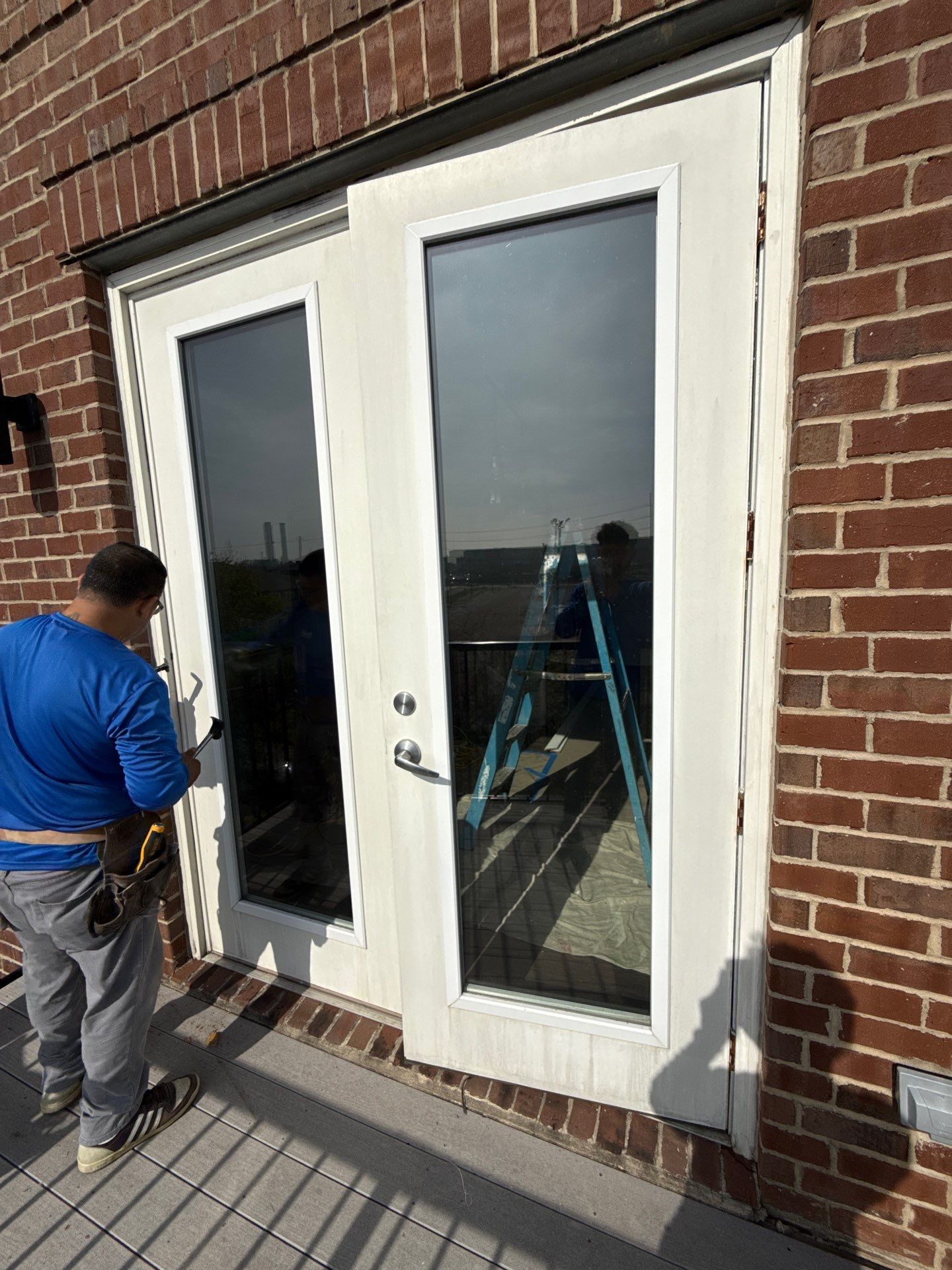 Existing French doors during exterior installation