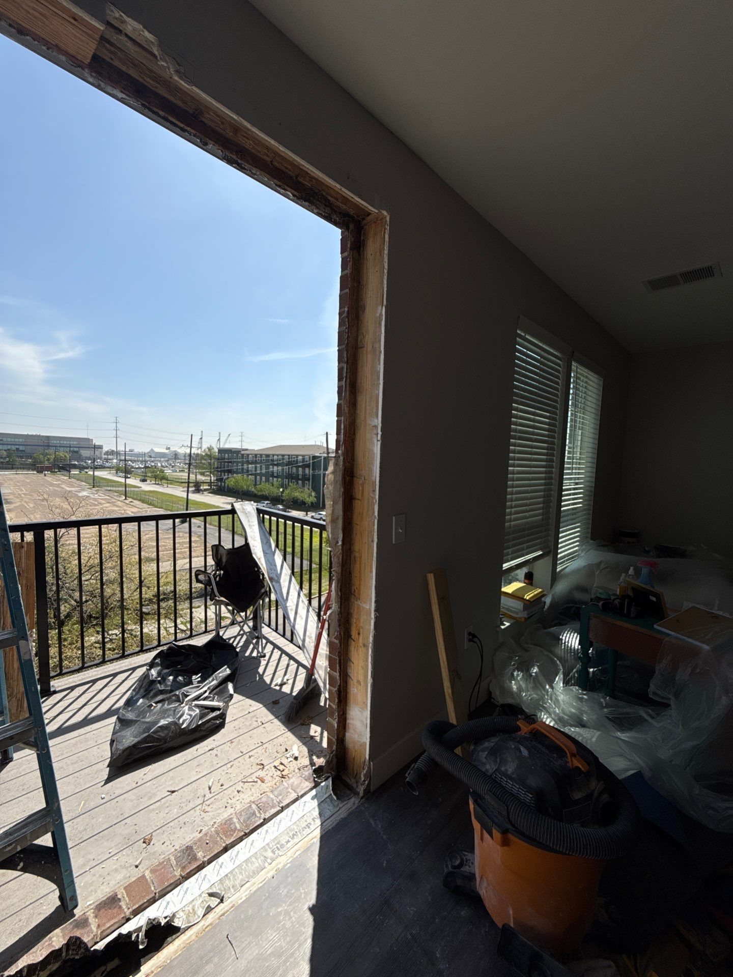 Stripped door opening and exposed perimeter framing