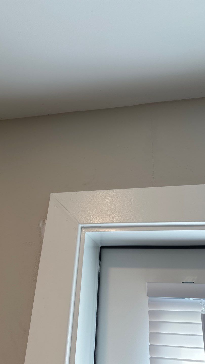 Wall above interior casing showing previous finish condition