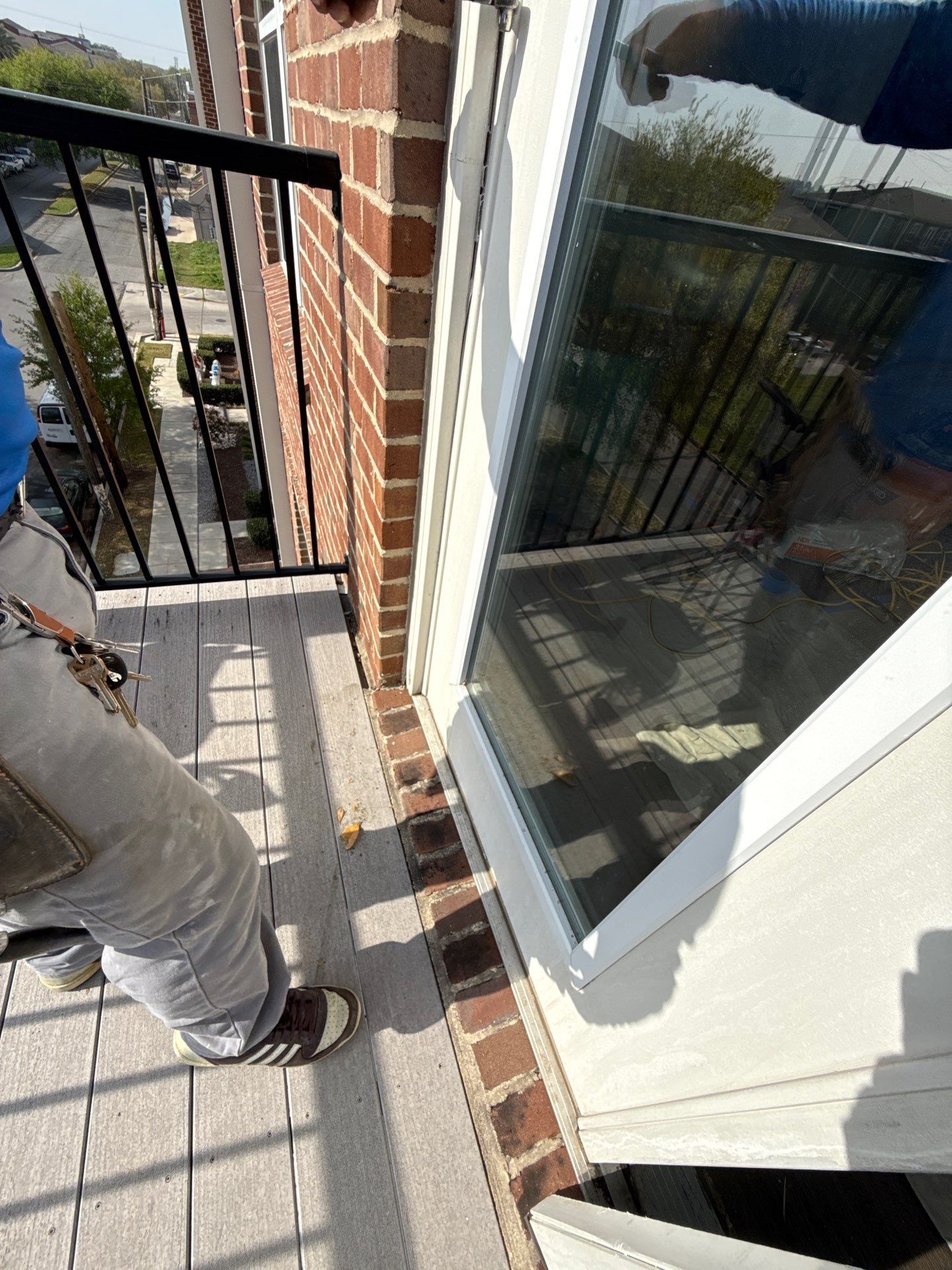 Existing door opened, showing brick threshold and sill