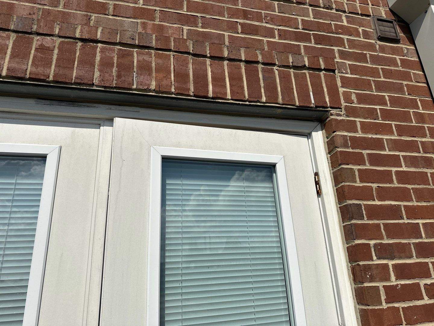 Existing exterior French doors with brick lintel overhead