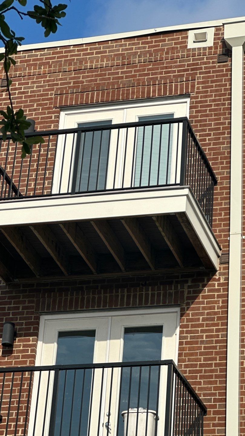 Building elevation showing upper and lower balconies